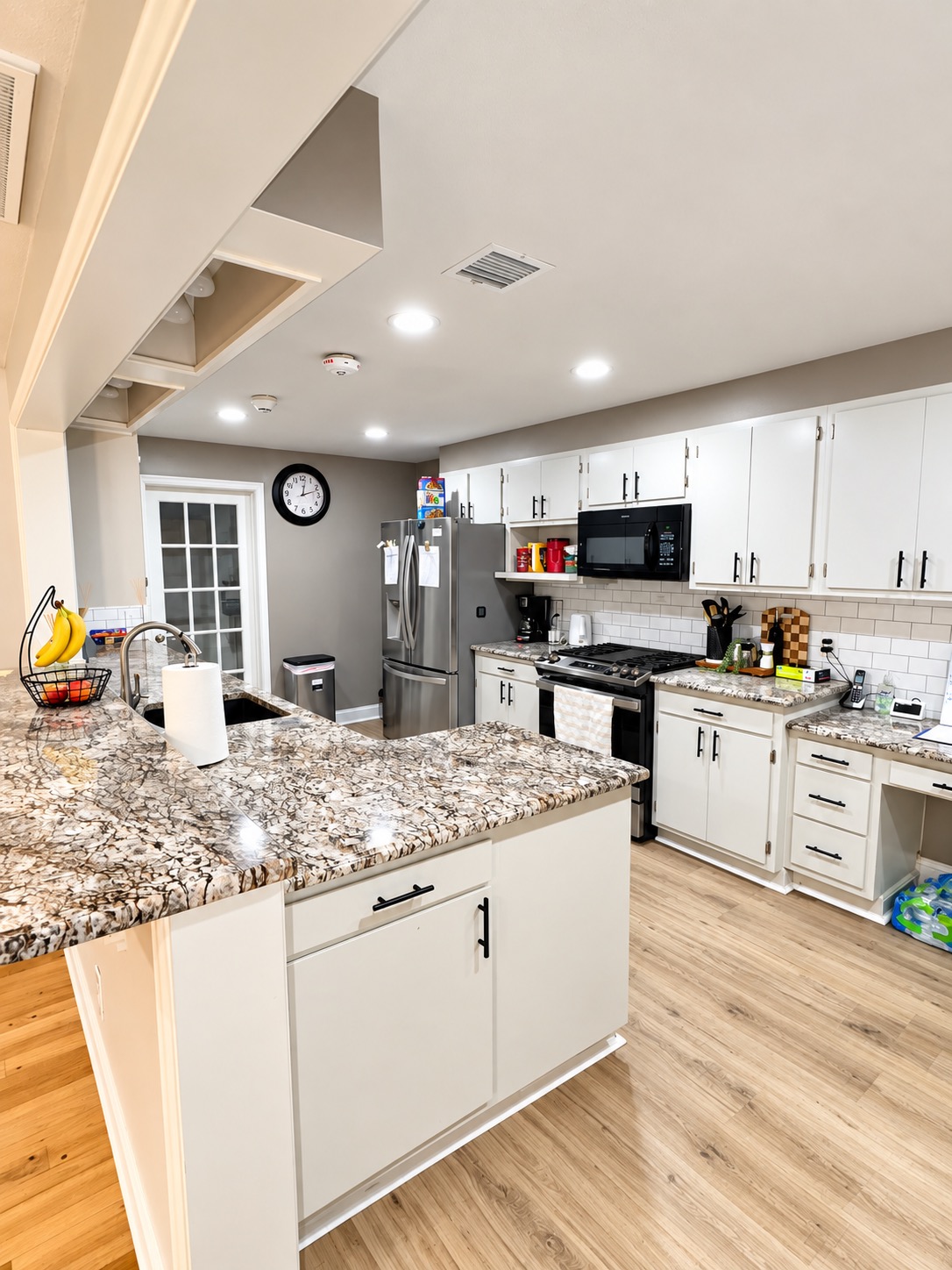 Kitchen island, countertops, and cabinets at Graceful Living