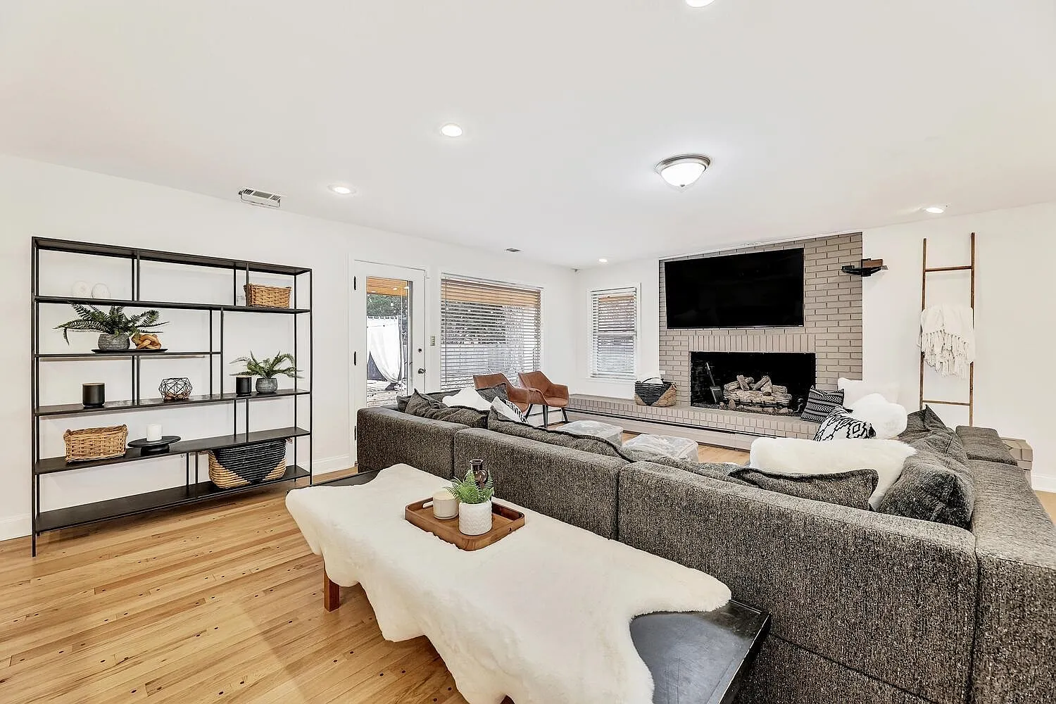 Cozy living room with comfortable seating and natural light at Graceful Living